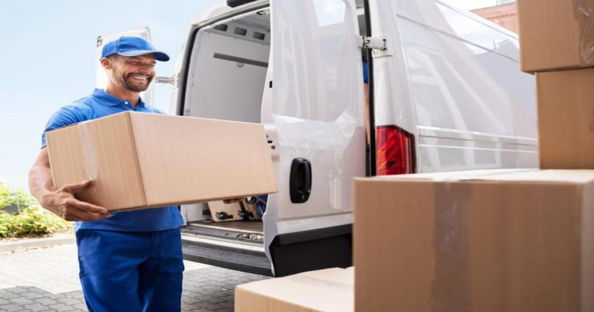 Professional movers packing household items using high-quality materials for relocation."
