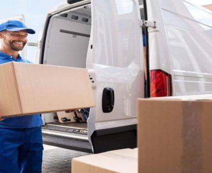 Professional movers packing household items using high-quality materials for relocation."