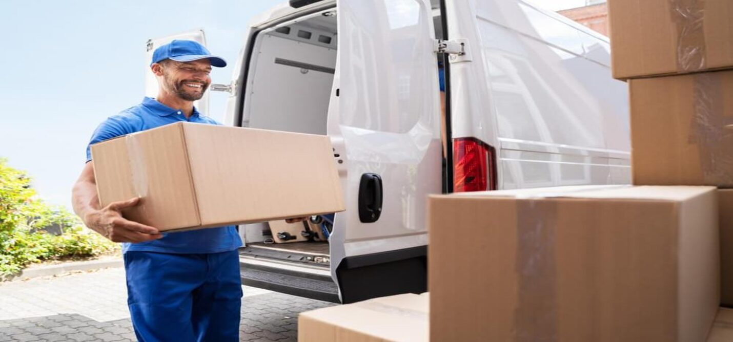 Professional movers packing household items using high-quality materials for relocation."